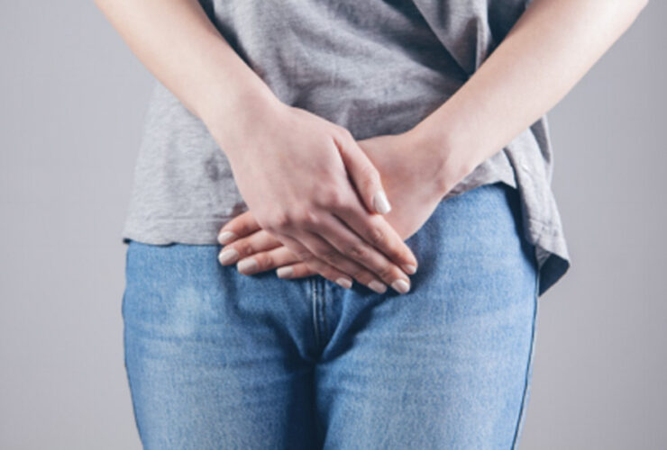 An image of a person wearing a gray shirt with jeans